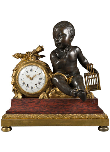 A French Rouge Marble Gilt and Patinated Bronze Mantel Clock by